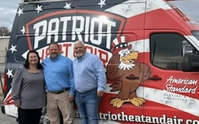 A Group Of People Standing In Front Of A Truck