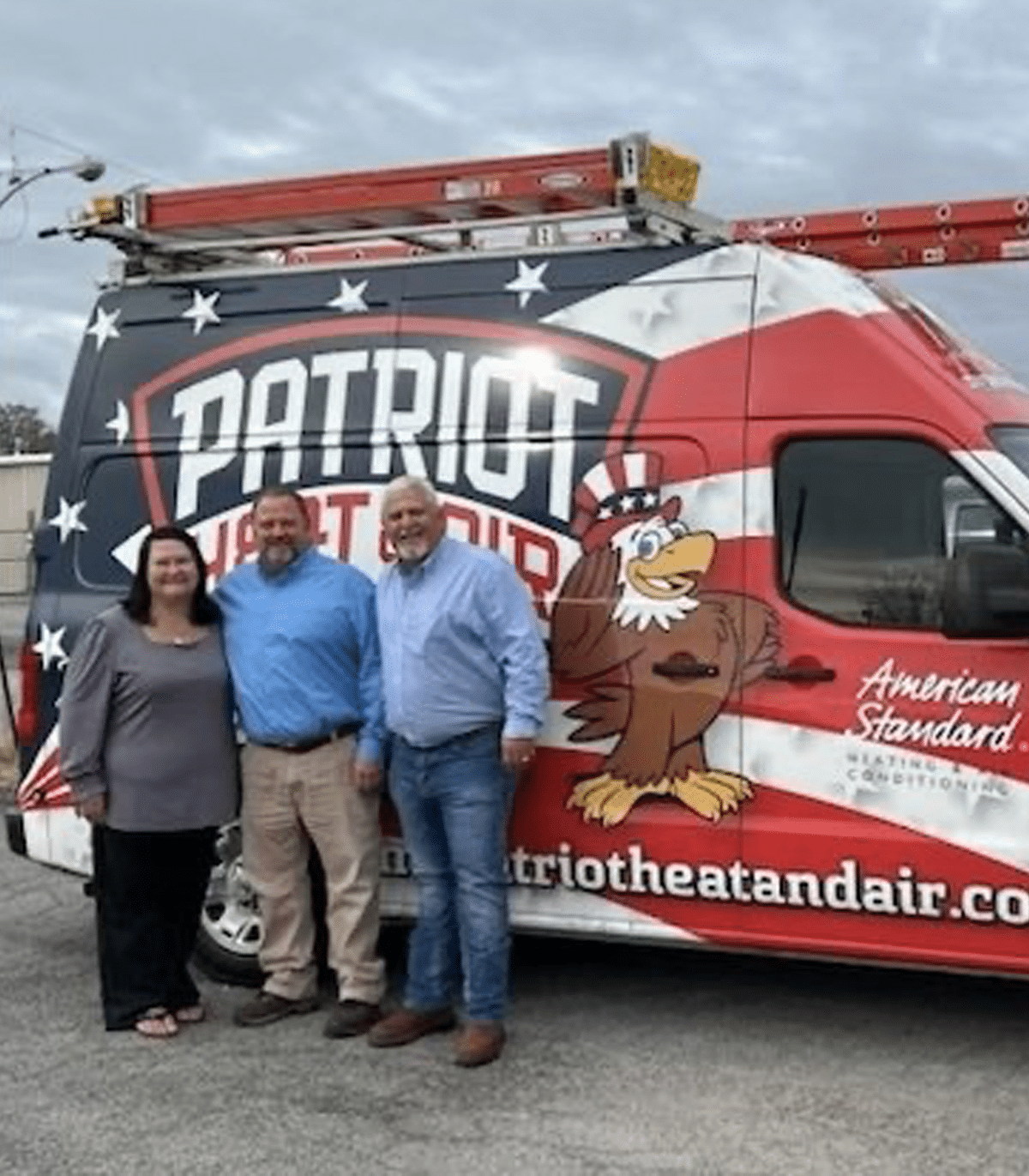 a group of people standing in front of a truck