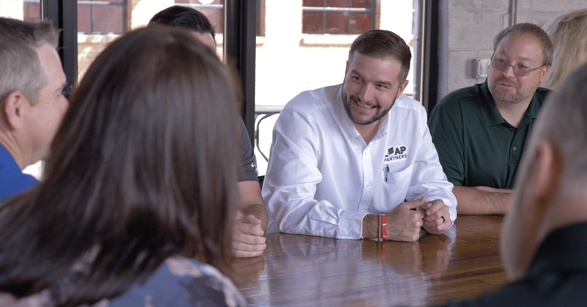 a group of people sitting at a table